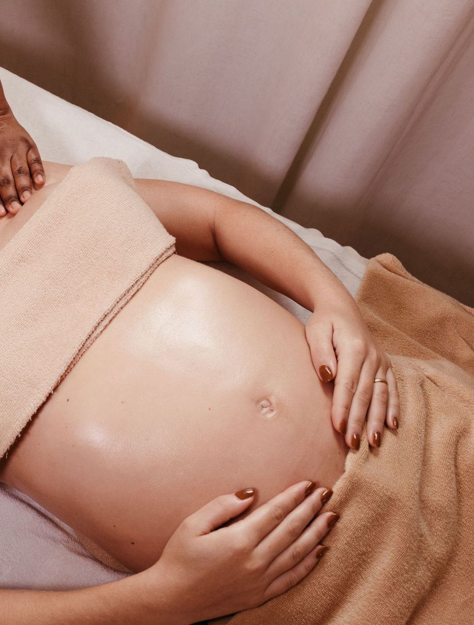 Pregnant woman enjoying a soothing prenatal massage in a spa. Relaxation and pampering at its best.